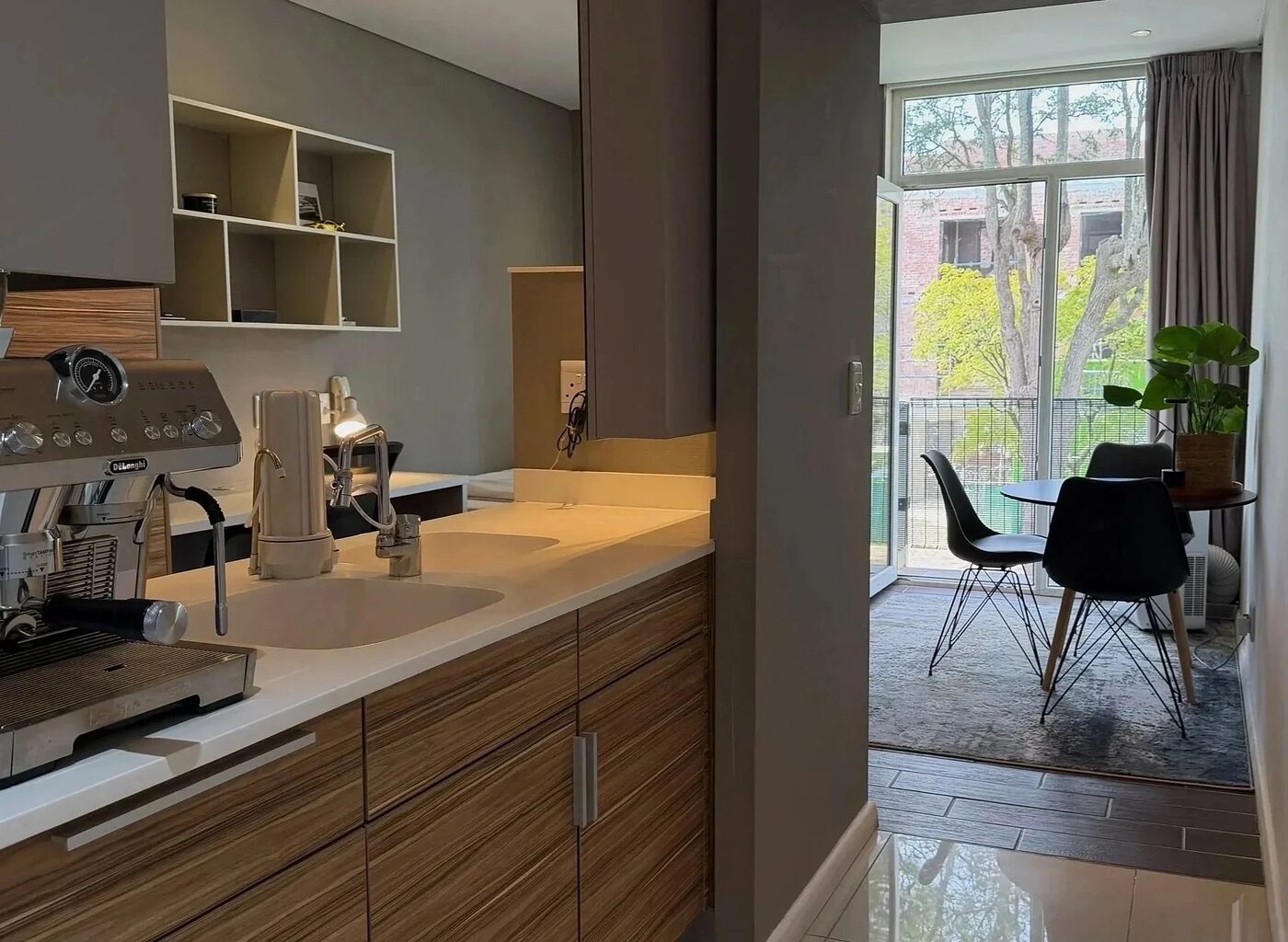 Kitchenette with counter space opening onto the dining area and balcony
